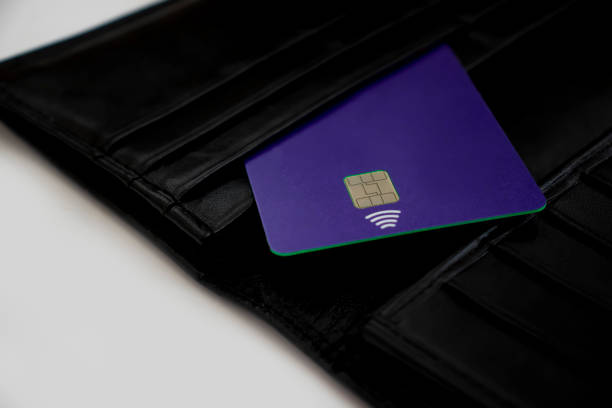 istock bank card black wallet background 1339511053