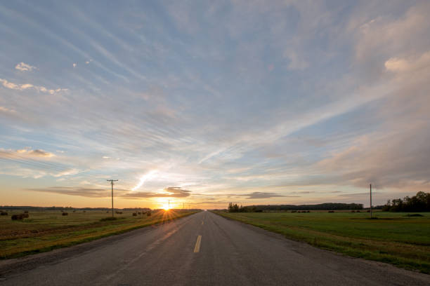istock Sunrise over highway in Saskatchewan, Canada 1339512855