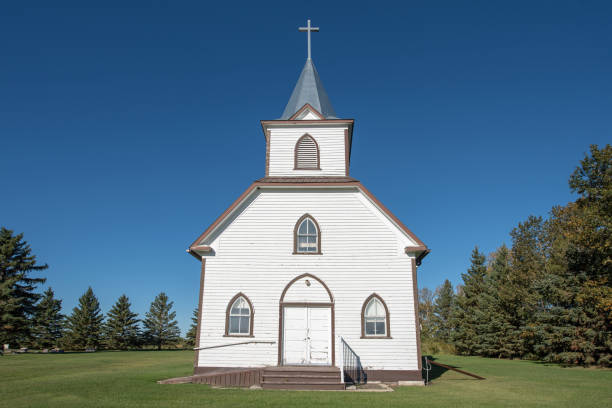 istock Old white church on a sunny day 1339513466