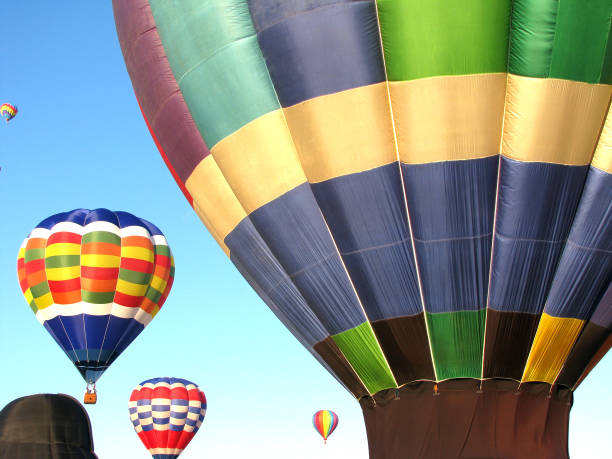 istock colorful hot air balloons with blue sky background 1339520385