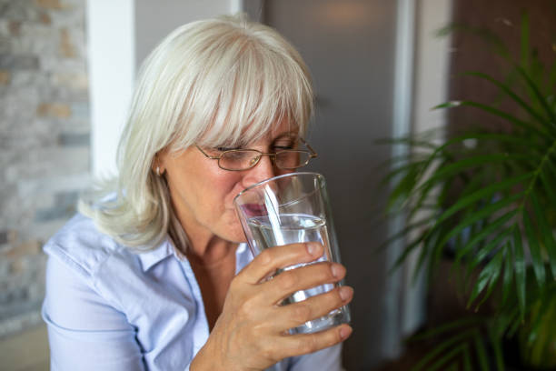 istock Woman With a Glass od Water 1339523743