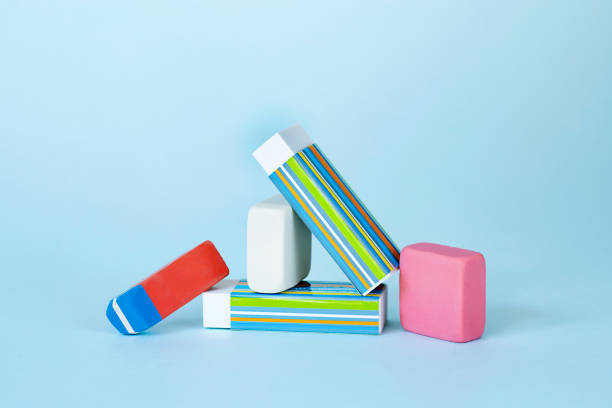 istock Pile of erasers on light blue background 1339526527