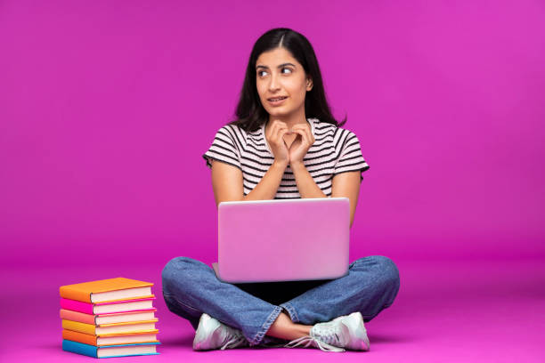 istock Young woman on purple background 1339527929