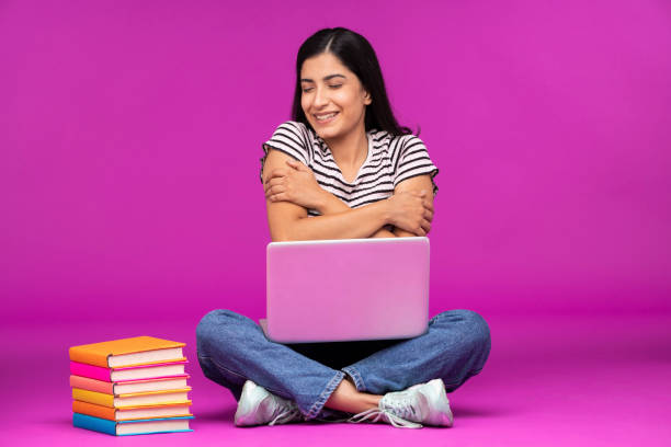 Young woman on purple background