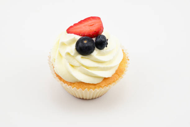 istock Pastry tartlet with custard, two blueberries and half strawberry 1339529249