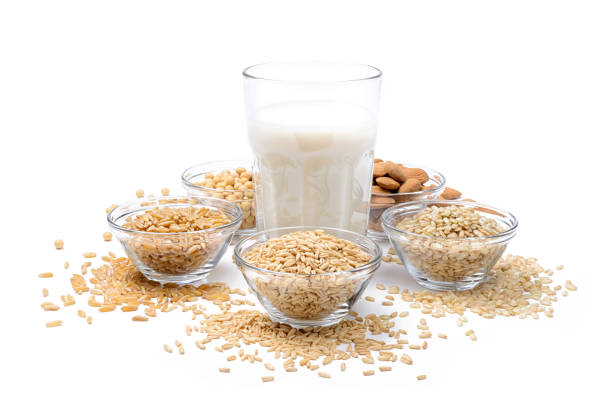 istock Vegetable milk, ingredients: oats, rice, almonds, soy and khorasan wheat isolated on white background. 1339533547