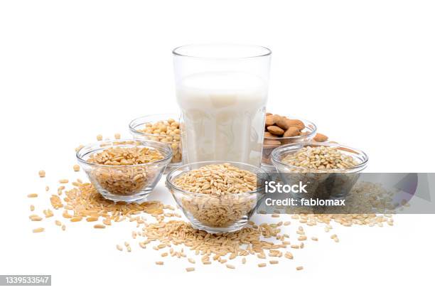 Vegetable Milk Ingredients Oats Rice Almonds Soy And Khorasan Wheat Isolated On White Background Stock Photo - Download Image Now