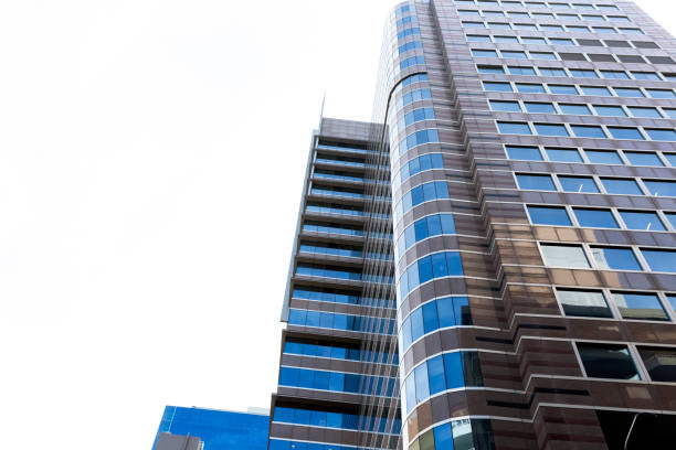 istock Low angle view of modern office buildings, skyscrapers, white background with copy space 1339534379