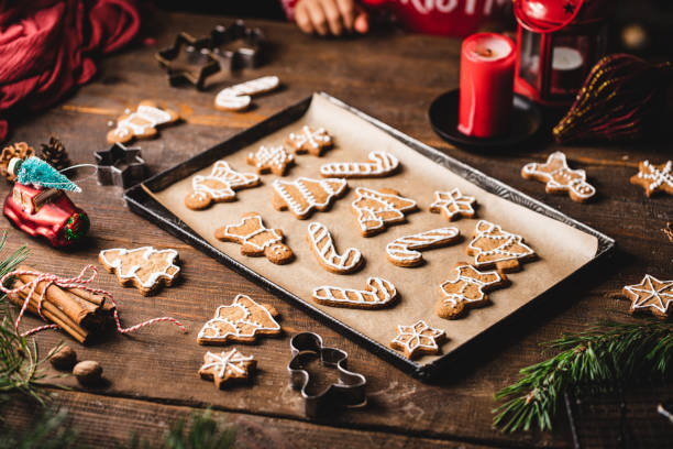 istock Various shaped christmas  cookies with icing in tray on table 1339535820