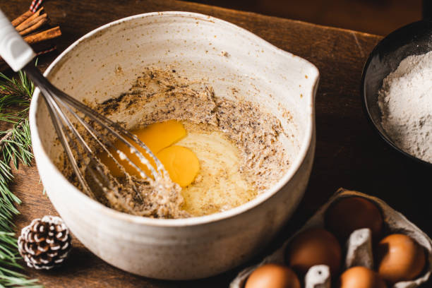 istock Wire whisk with egg yolk and flour mixture in bowl 1339535854