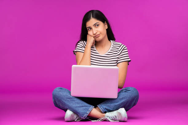 istock Young woman on purple background 1339537928