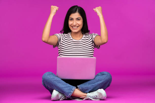 istock Young woman on purple background 1339538223