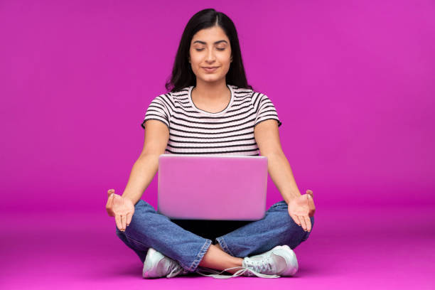 istock Young woman on purple background 1339538809