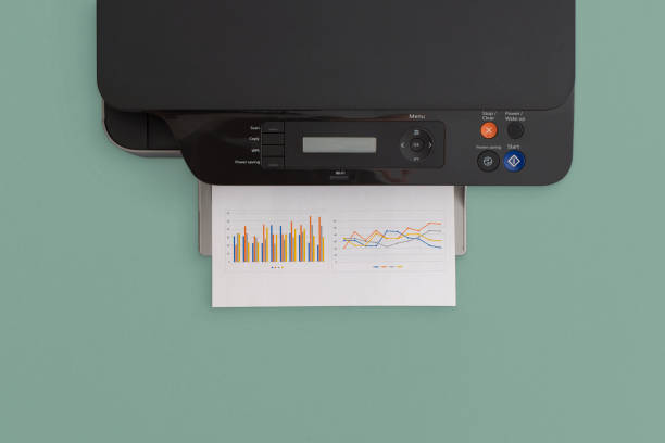 Printer on green background. Top view with copy space. Flat lay. Printer on green background. Top view with copy space. Flat lay. computer printer stock pictures, royalty-free photos & images