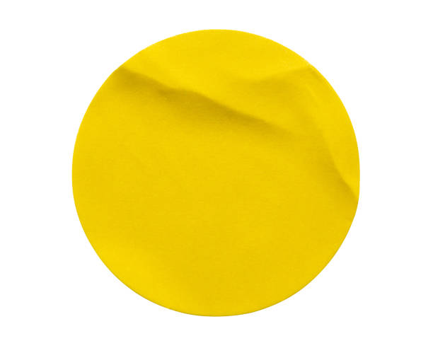 istock Yellow round paper sticker label isolated on white background 1339550755