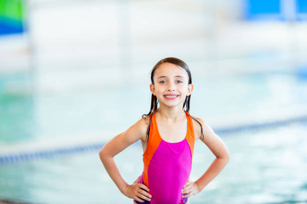 istock Smiling little girl at swimming class 1339551993