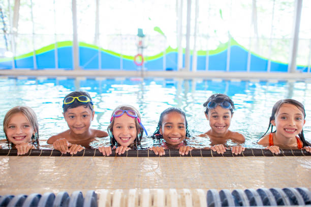 istock Multi ethnic group of children during swimming class 1339552012
