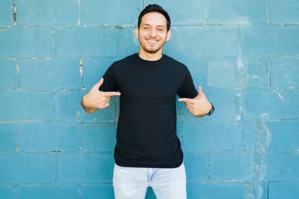 istock Excited man wearing a black casual t-shirt 1339552155