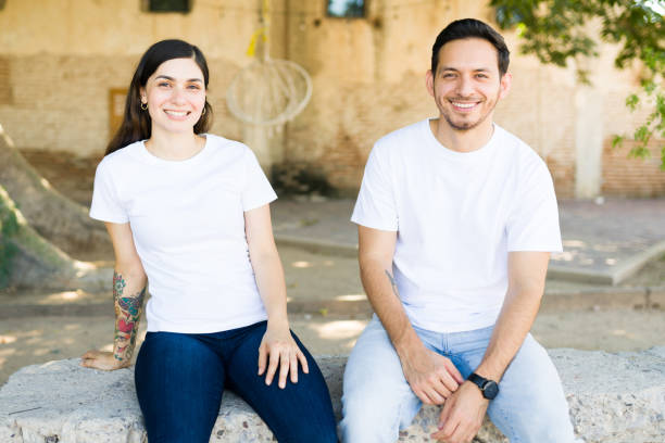 istock Attractive couple with custom print t-shirts 1339552194