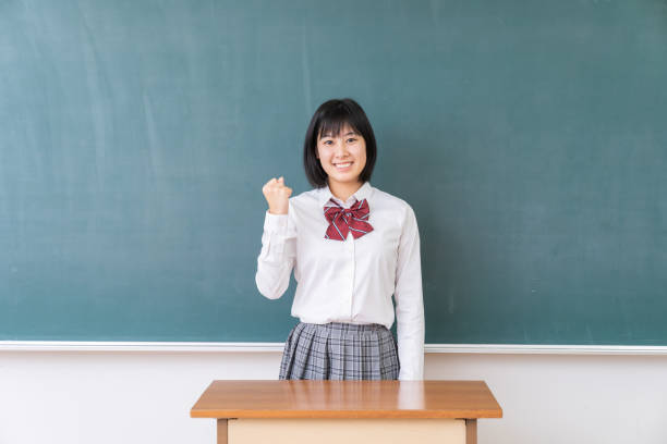 istock young asian school girl,blackboard 1339554806