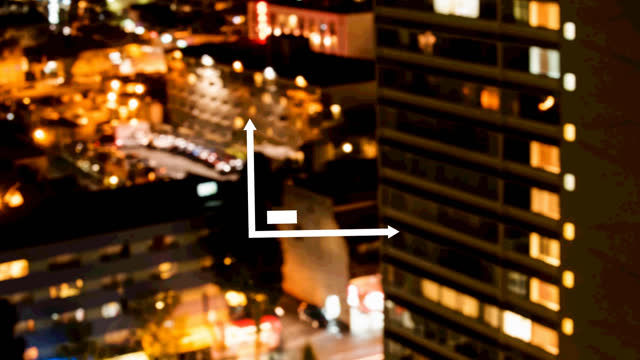 Bar graph icon against aerial view of night cityscape