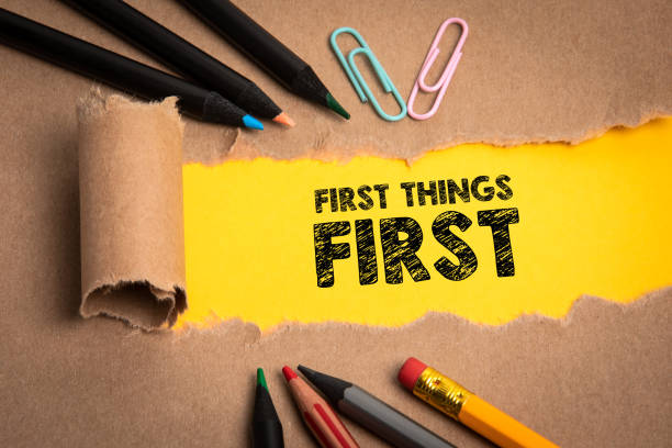 istock First things first. Torn cardboard and office supplies 1339556636