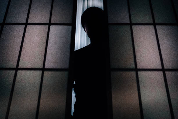 Silhouette of a man who opens the shoji and looks down Silhouette of a man who opens the shoji and looks down creepy stalker stock pictures, royalty-free photos & images