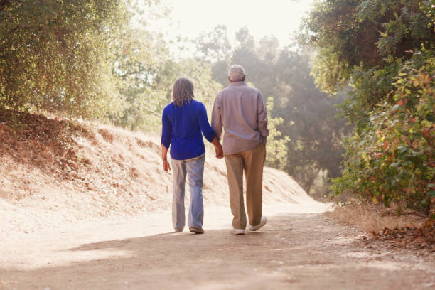 istock Senior Black Couple Walking on a Nature Trail 1339560756