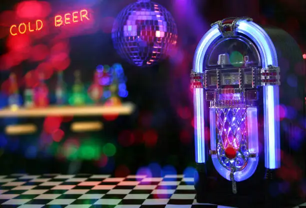 Jukebox in Bar with Disco Ball and Bokeh Composite Image
