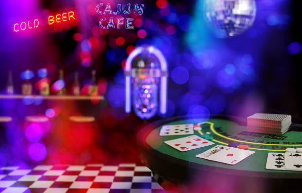 istock Miniature Poker Table Bar Scene Composite Image With Neon Signs and Bokeh 1339562566
