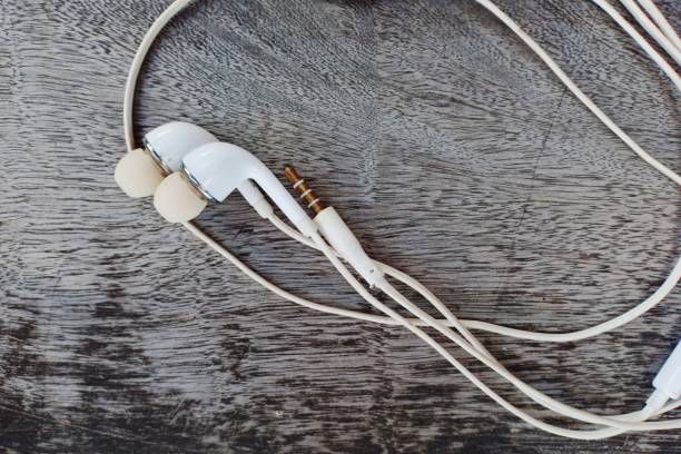 istock white headset on wooden board background 1339568672