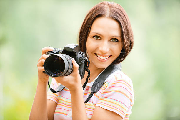 istock A beautiful girl holding a camera  133957238