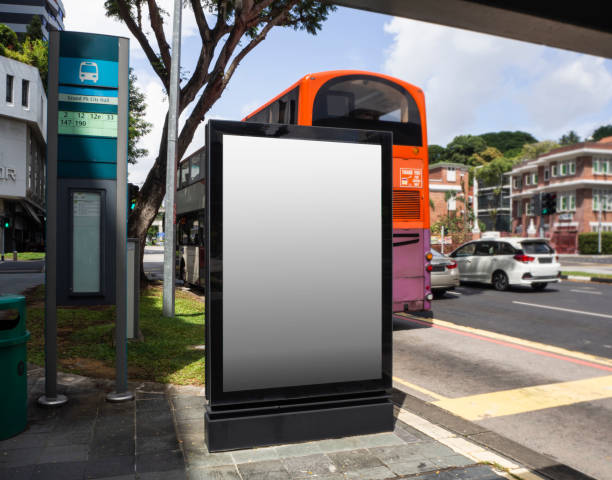 Blank billboard mock up at a bus stop with busy traffic in Singapore Blank billboard mock up at a bus stop with busy traffic in Singapore. banner commercial sign outdoors marketing stock pictures, royalty-free photos & images