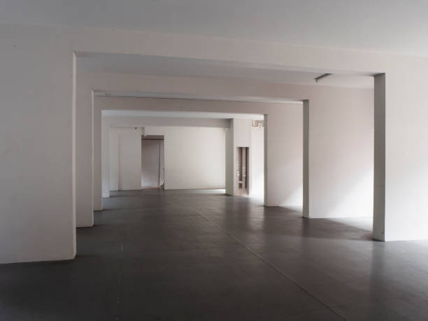 istock Abstract, empty void deck of an apartment block with sunlight streaming in 1339575895