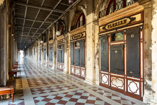 Venice, Italy - July 5, 2021: colonnade at St. Mark's square with closed cafe Florian in early morning.
