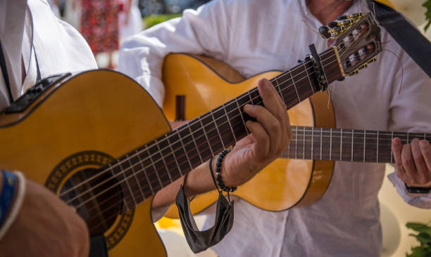 istock Man's Hands Playing The Spanish Guitar 1339583067