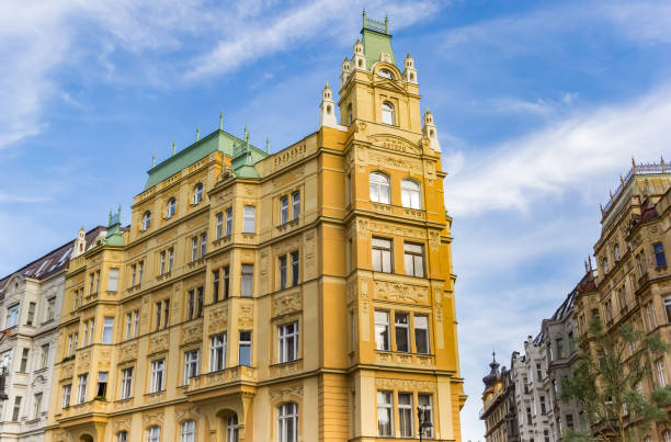 Historic yellow apartment building in Prague, Czech Republic