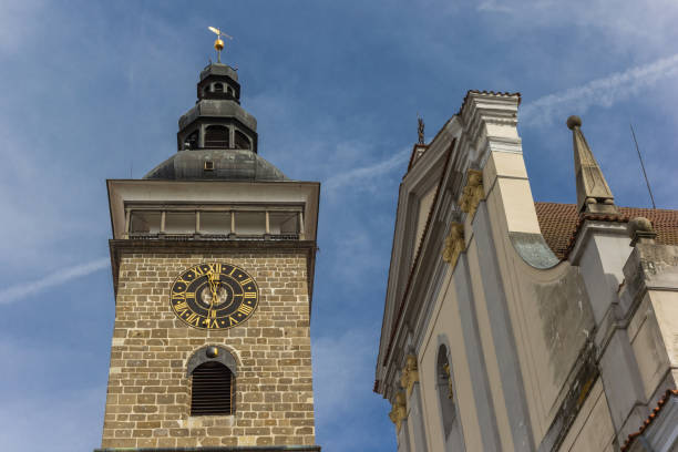Black tower and facade of the cathedral in Ceske Budejovice Black tower and facade of the cathedral in Ceske Budejovice, Czech Republic cesky budejovice stock pictures, royalty-free photos & images