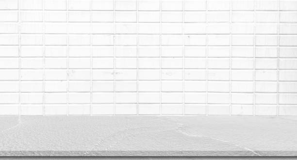 istock blur white retro brick pattern background of loft style interior kitchen room with gray perspective table for show ,promote and advertise content or  product on display 1339588525