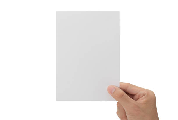 istock Hand holding blank paper isolated on white background with clipping path, Greeting card mockup 1339591869