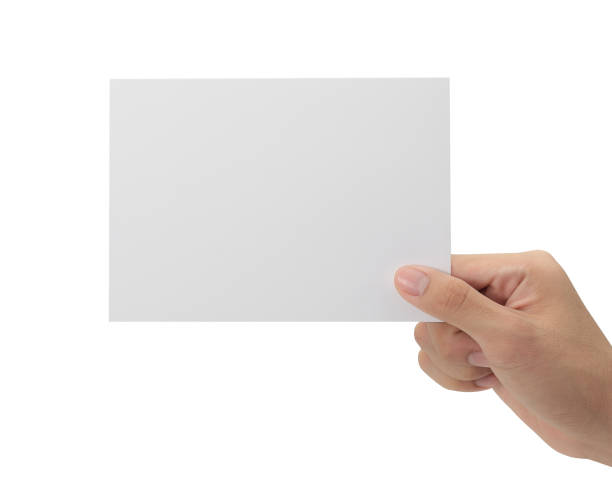 istock Hand holding blank paper isolated on white background with clipping path, Greeting card mockup 1339591870