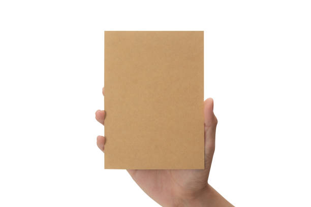 istock Hand holding blank cardboard paper isolated on white background with clipping path, Greeting card mockup 1339591878