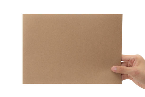 istock Hand holding blank cardboard paper isolated on white background with clipping path, Poster Mockup 1339591881