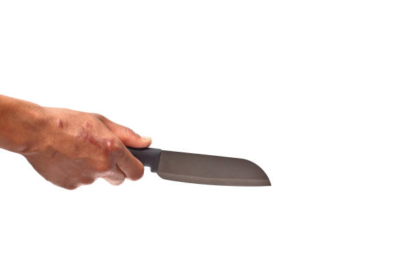 istock Hand holding a kitchen knife on a white background 1339591952