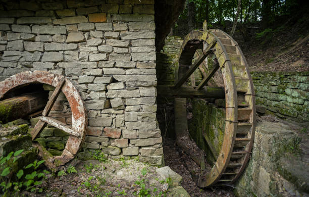 istock Old abandoned water mill in the wild Ukrainian forest 1339593896
