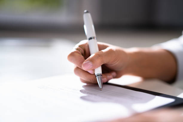 istock Lawyer Signing Business Contract Paper Document 1339597047