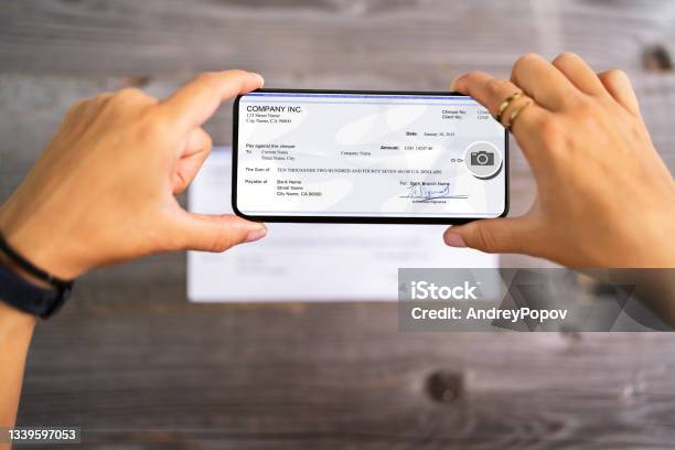 Remote Check Deposit Taking Photo With Phone Stock Photo - Download Image Now - Bank Deposit Slip, Check - Financial Item, Mobile Phone