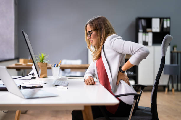 back pain bad posture woman sitting - wrong injury imagens e fotografias de stock