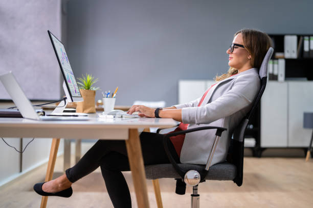 istock Woman Sitting In Bad Posture Working On Computer 1339597064