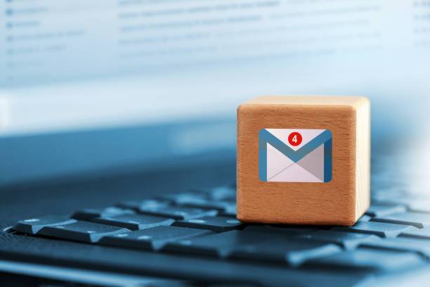 Nail symbol on wooden cube indicates that new mail has been received on the laptop computer